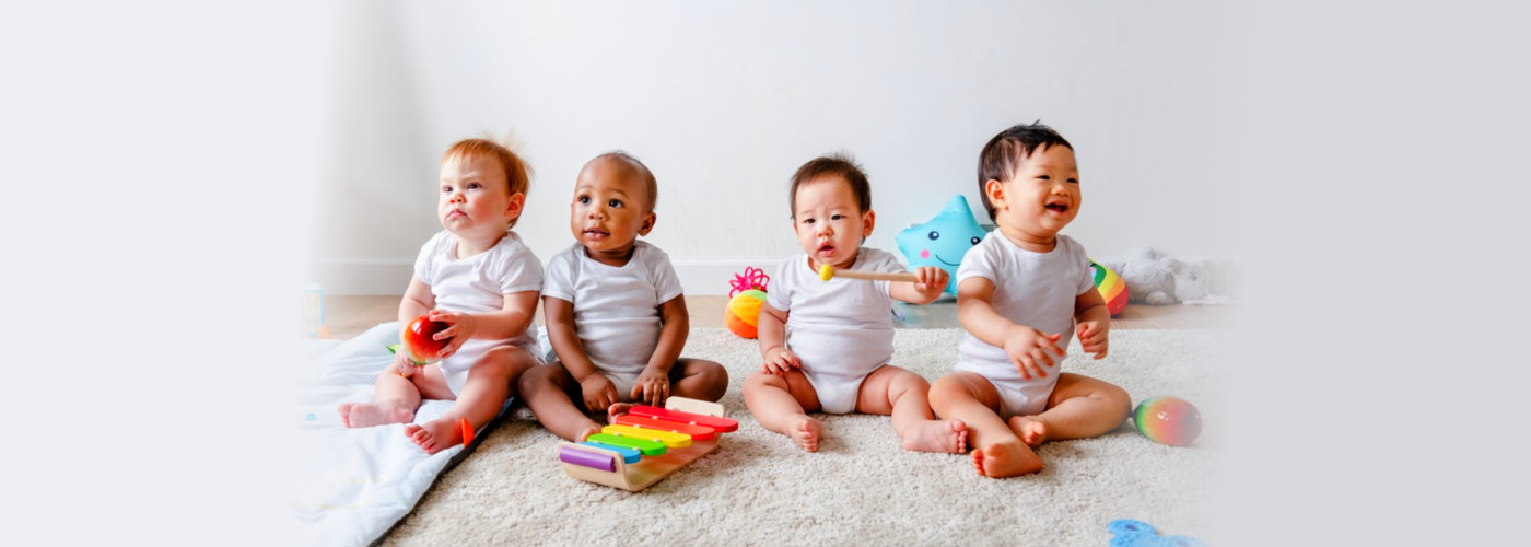 multi racial babies playing